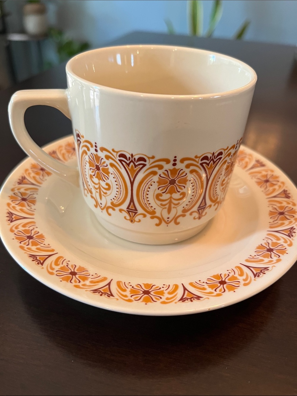Vintage Teacup and Saucer Set with Orange and Brown Pattern